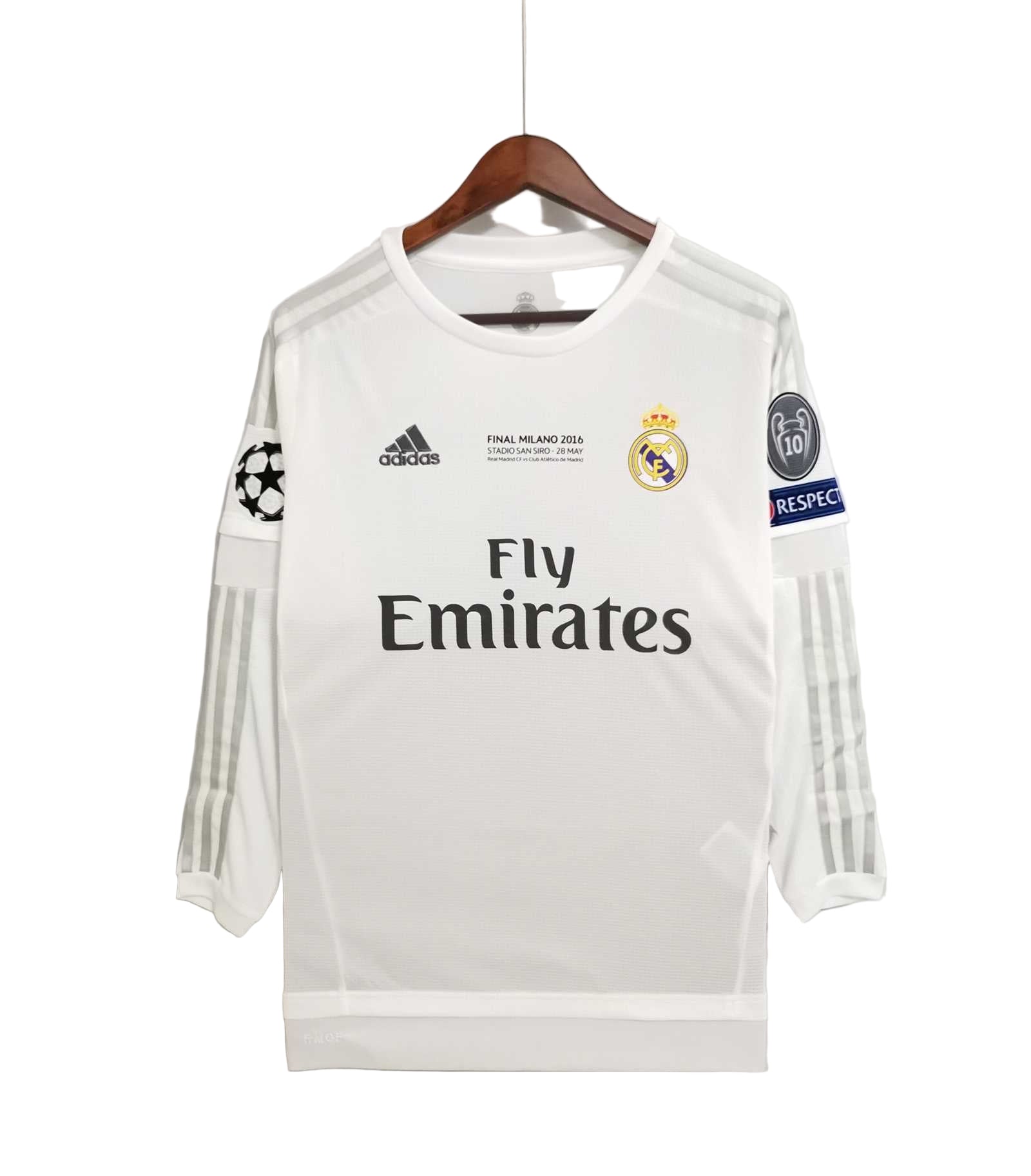 White soccer jersey with Adidas and Real Madrid logos on a hanger against a white background