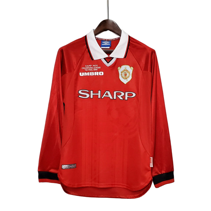 Manchester United 1999 UCL Final long sleeve jersey in red with white collar, Umbro logo on sleeves, and Sharp logo on the front.